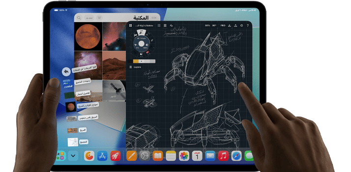 جهاز iPad Pro‏، لون أسود فلكي، يد يسرى تحمل الجهاز، يد يمنى تشير إلى الشاشة للتحكم في عدة نوافذ تطبيقات مفتوحة، تطبيق رسم مع رسومات لتصاميم ميكانيكية، مكتبة صور للكواكب والفضاء، ملفات في مجلد التنزيلات معروضة على شكل مروحة