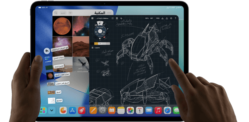 جهاز iPad Pro‏، لون أسود فلكي، يد يسرى تحمل الجهاز، يد يمنى تشير إلى الشاشة للتحكم في عدة نوافذ تطبيقات مفتوحة، تطبيق رسم مع رسومات لتصاميم ميكانيكية، مكتبة صور للكواكب والفضاء، ملفات في مجلد التنزيلات معروضة على شكل مروحة